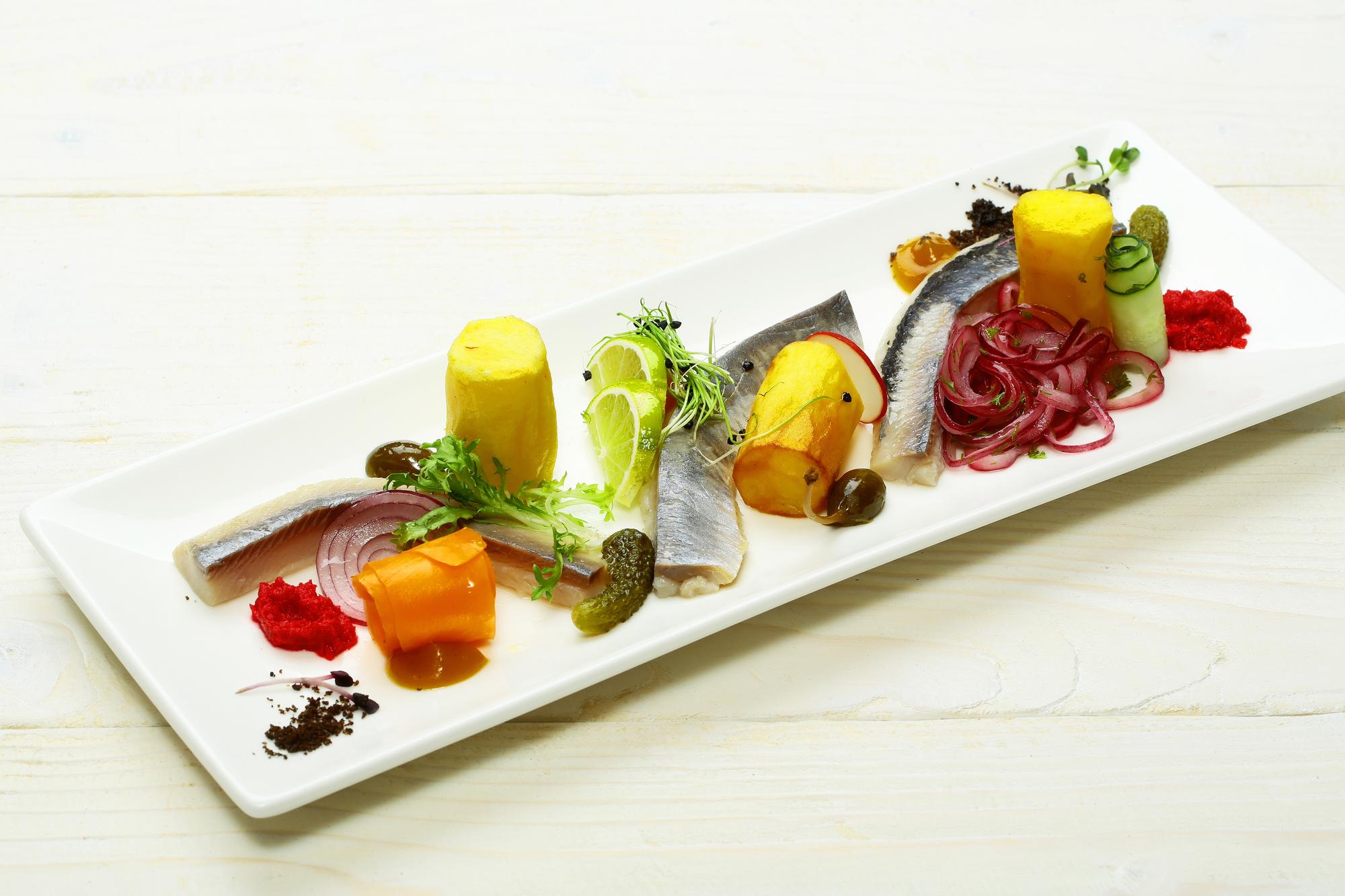 Line of plated appetizers in studio lighting